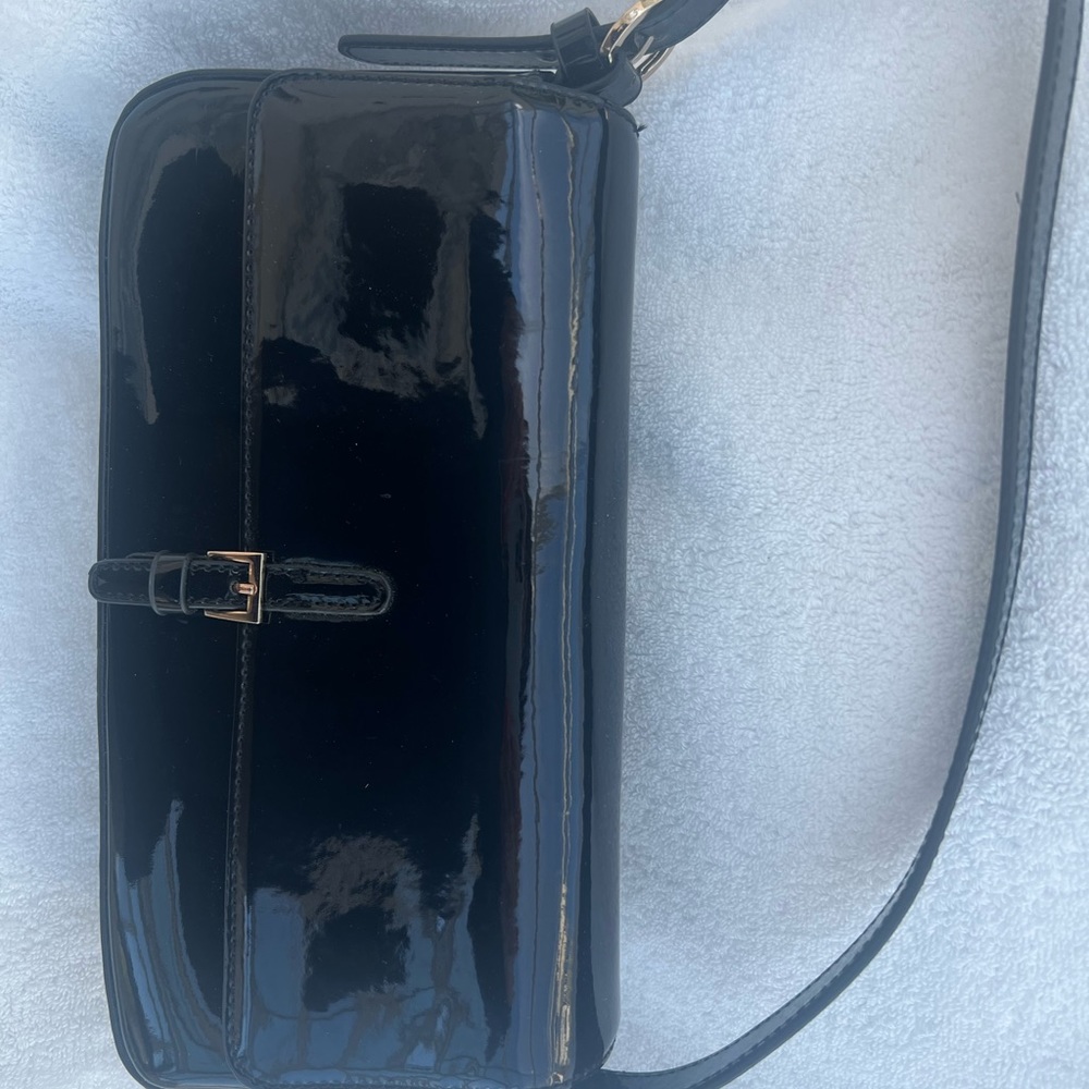 Black patent leather bag.